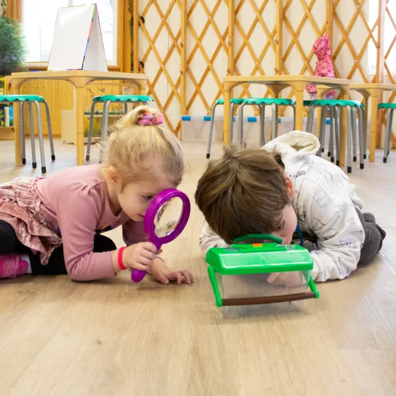 Two kids examining a box