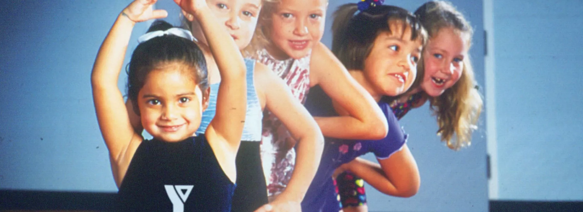 Five girls at a gymnatics practice.